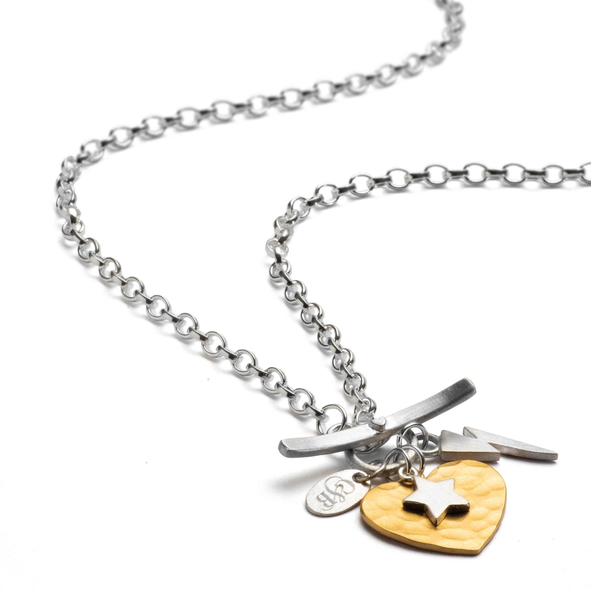 sterling silver charm necklace with gold heart